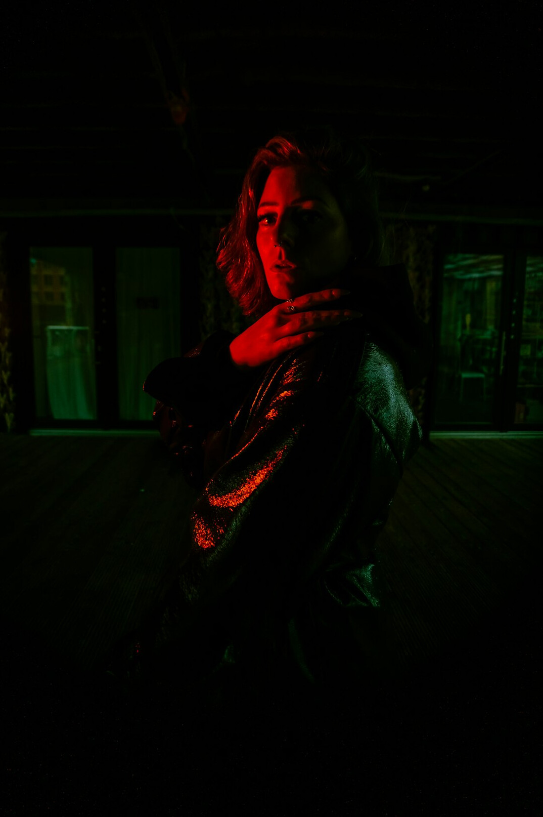 Portrait of a German woman of sixty-five with curly gray hair and a burgundy shawl