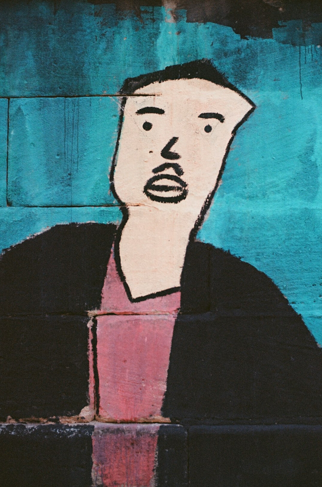 Portrait of a German man of sixty-six with a gray mustache in a blue work jacket
